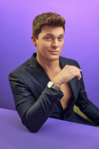 Zack Wickham in a navy blazer, photographed by Ryan Grant for Queer Kentucky