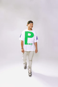 Zack Wickham wearing a Peace t-shirt, photographed by Ryan Grant for Queer Kentucky