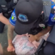 Screenshot from police body camera footage showing multiple Covington police officers restraining a person on the ground during the July 17, 2025, Roebling Bridge protest. The image captures officers in uniform holding the individual facedown while attempting to control the situation. Photo Provided by Covington Police Department
