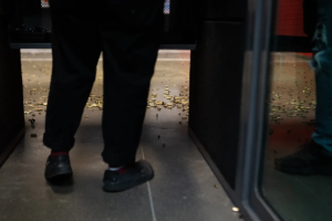 Spent bullet casings scatter across the floor beneath Xian Brooks' feet inside an indoor gun range in Louisville, Kentucky.