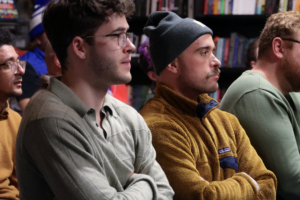 Logan Richardson and Spencer Jenkins listen during Queer Kentucky’s Queer Politics in the Bluegrass legislative preview panel in Newport, seated among community members at the event. Photos by Murphy Meador Communications.