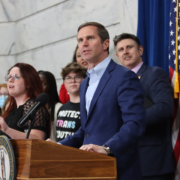 Gov. Andy Beshear and Fairness Campaign Executive Director Chris Hartman speak at an LGBTQ rights rally during Kentucky’s General Assembly in Frankfort. 2026 Legislative session starts tomorrow.