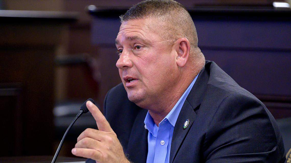Kentucky Rep. Bill Wesley speaks into a microphone during a legislative meeting at the Kentucky State Capitol in Frankfort.