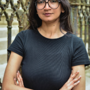 Divya Karthikeyan, Editorial Manager at Queer Kentucky, standing outdoors.