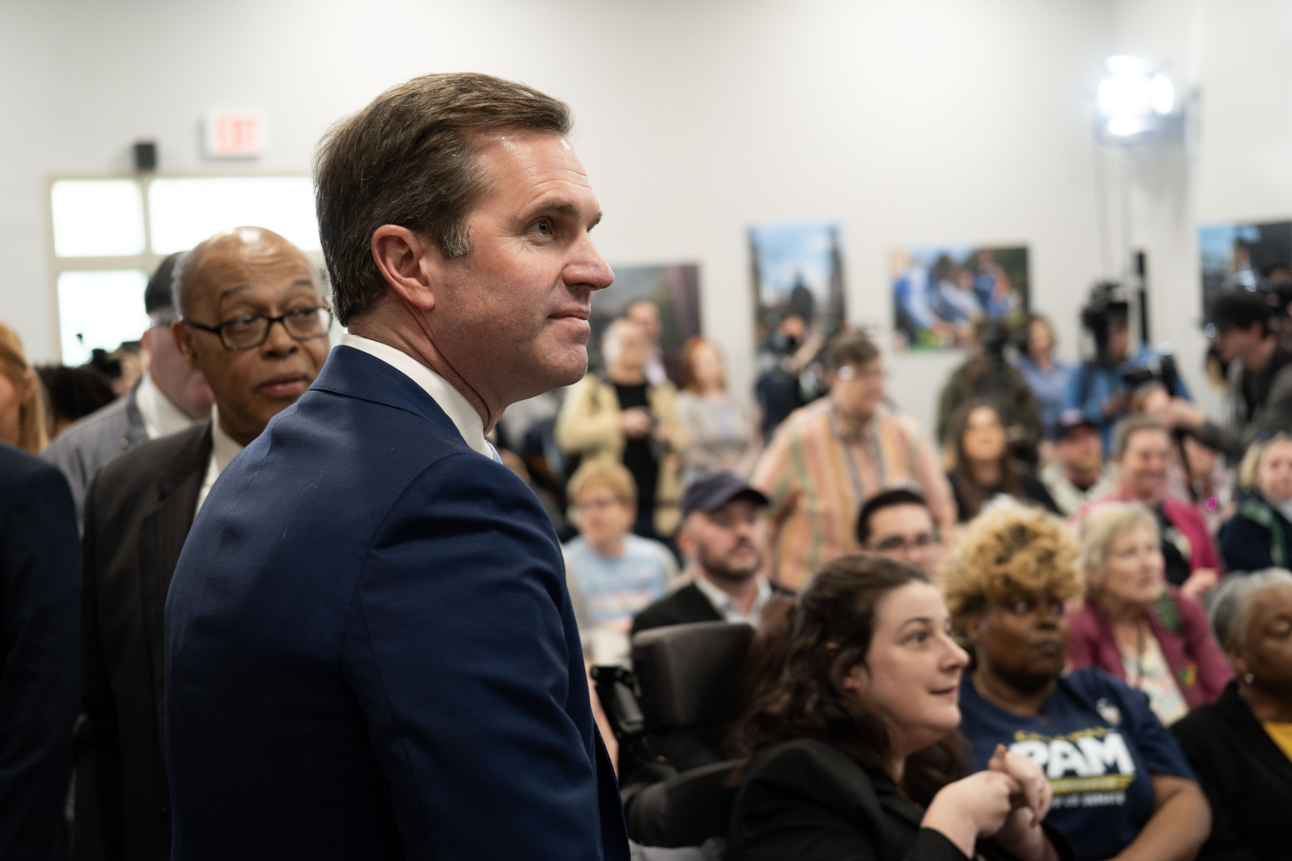 Gov. Andy Beshear speaks at a podium at the 2026 Fairness Rally in Kentucky.
