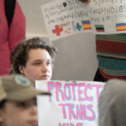 A person holds a Protect Trans Youth sign at the 2026 Fairness Rally in Kentucky.